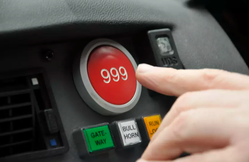 Image of someone pressing 999 button