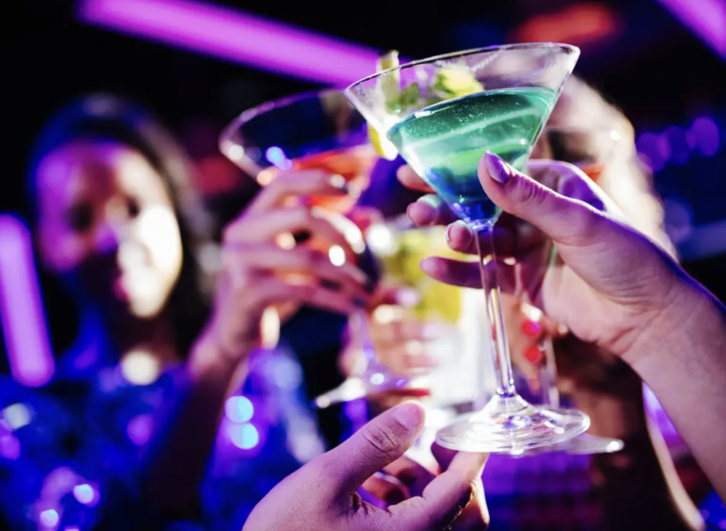 Image of people holding cocktails - drinks